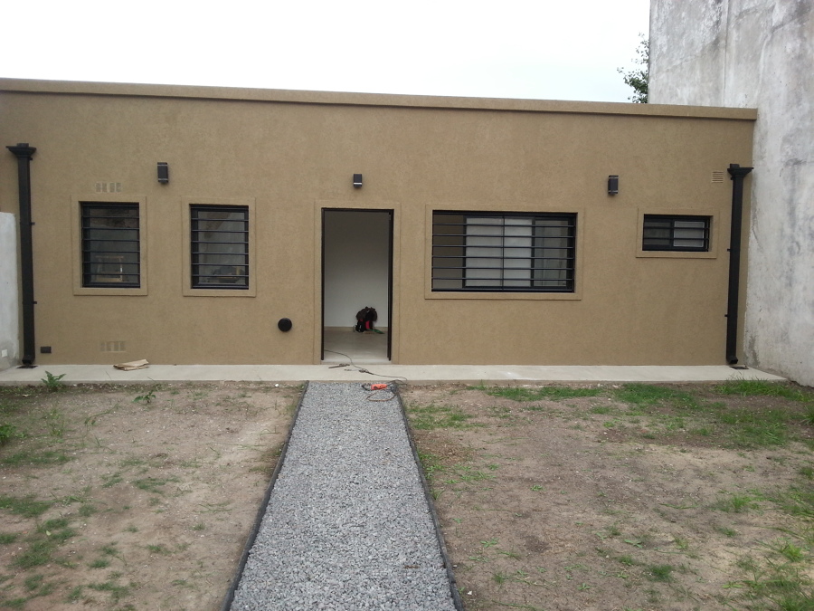 Revestimiento con tarquini. Fachada de la vivienda.
