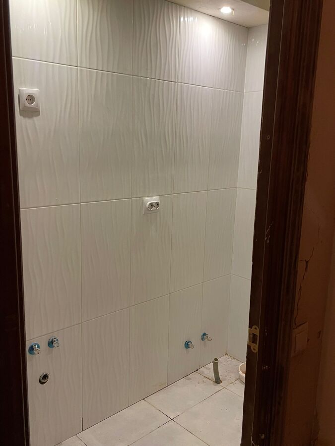 ALICATADO EN BAÑO