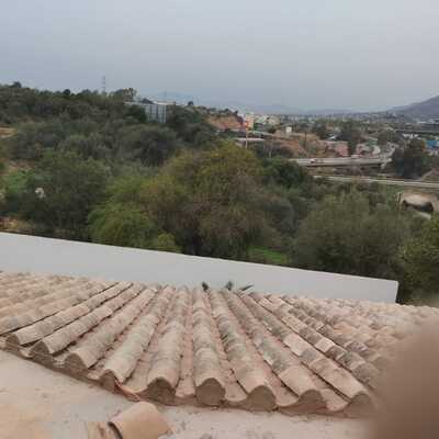Colocacion de tejas antiguas en este caso