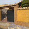 Construcción de muro de hormigón de 25 ml y puerta de aluminio