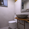 Construir dos cuartos de baños en local.