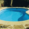 Cambiar bordillo piscina y pegar piedras fachada
