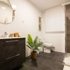 Informe perito sobre daños agua baño apartamento