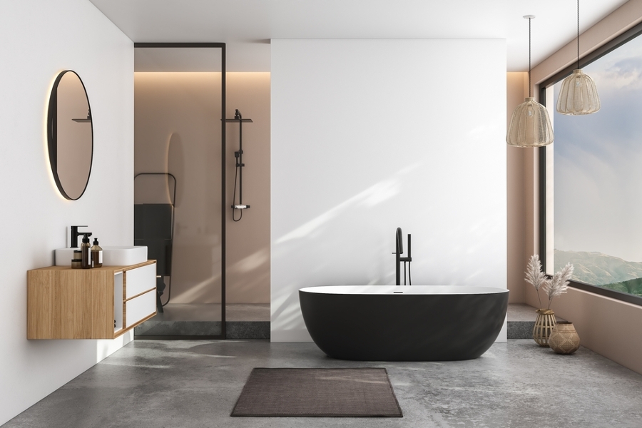 Baño con bañera negra y ducha
