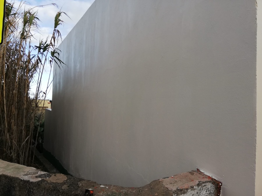 Pintura exterior de vivienda paredes laterales