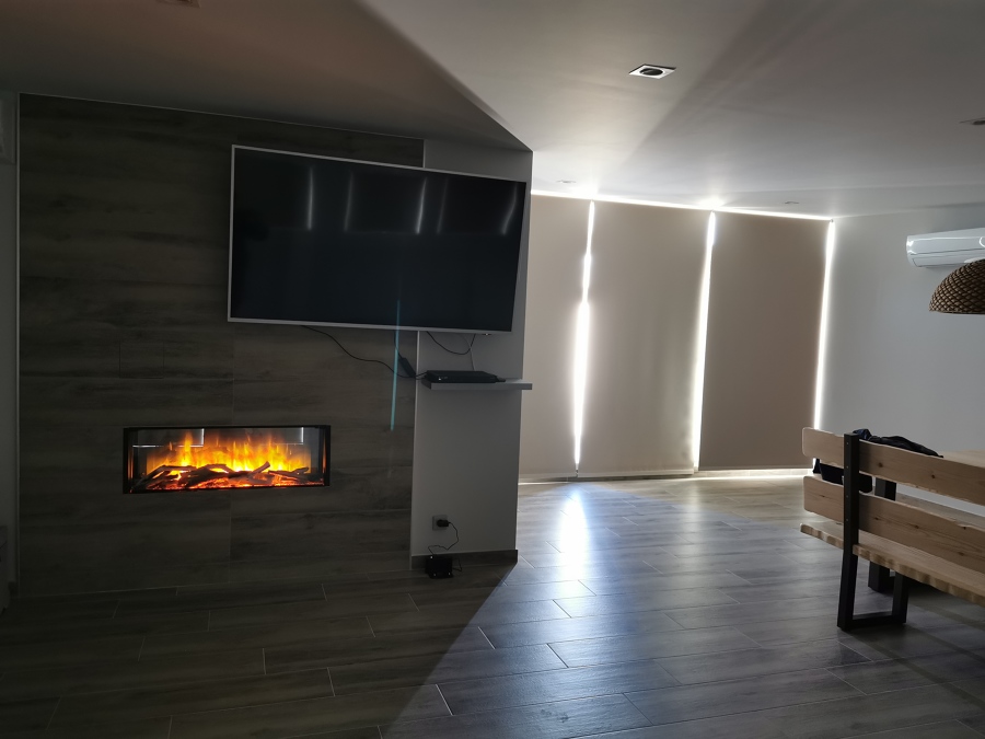 Zona chimenea y TV