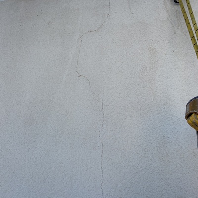 Rehabilitación y pintura térmica de fachada lateral de 150 m²