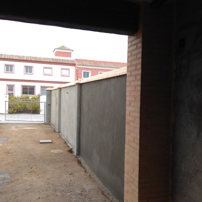 Construcción de medianeras con vecino y porche