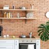 Cocina con pared de ladrillo vista