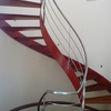 Escalera de caracol con baranda en acero Inoxidable