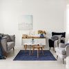 Salón estilo contemporáneo con butacas y sofá