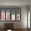 Salón , ventanas de PVC y carpintería de madera