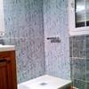 Sustitución de plato de ducha y azulejos sólo de la zona que abarca el plato de ducha de resina