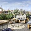 Terraza con muebles de ratán y palets con colchonetas