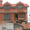 Vista frontal chalets con perimetros en ladrillo visto