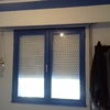 Tres ventanas de alumnio lavado blanco de rpt en dos hojas oscilobatientes con tambor persiana térmica doble acristalamiento 4+16+4 una puerta bandera de las mismas características de salón colocado con retirada de escombros