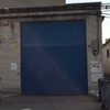 Suministro y colocación puerta basculante metálica en nave industrial