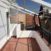 Ampliar puerta de acceso a la terraza instalando puerta corredera de cristal y también restaurar exterior de la terraza