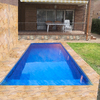 Piscina de obra en jardín privado