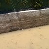 Hacer informe pericial sobre cerramiento de agujeros de aguas pluviales en servidumbre (medianera entre vecinos)