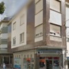 Reparar/mejorar fachada edificio, según se ve en la foto