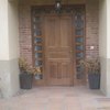Aislar puerta de entrada del frío con cerramiento cristal (tipo porches)