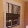 Colocar dos rejas en ventanas