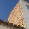 Proyectar poliuretano en la fachada y pintar de blanco
