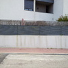 Lijar y pintar valla exterior de casa