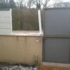 Reparar y reconstruir muro exterior jardín