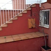 Hacer habitación bajo escalera de entrada del adosado