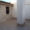 Cerramiento de terraza en aluminio, cristal y techo de panel sanwich
