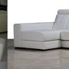 Tapizado de asientos y respaldos de un sofá con chaise longue