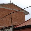Enlucir lateral que está de ladrillo de una casa